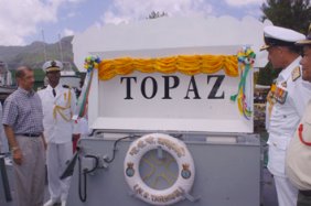 President Michel (left) and Admiral Prakesh after the plaque bearing the vessel's new name had been unveiled